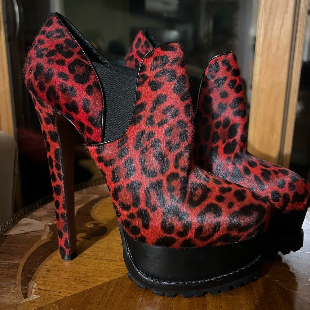 Red cheetah print calfskin Alaia platform heel booties.